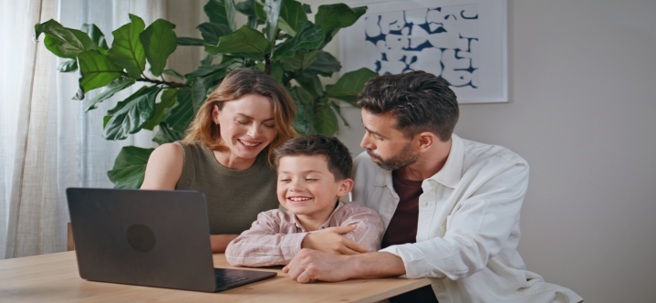 Family reviewing U.S. family sponsorship and Green Card options together at home on a laptop, representing family-based immigration planning.