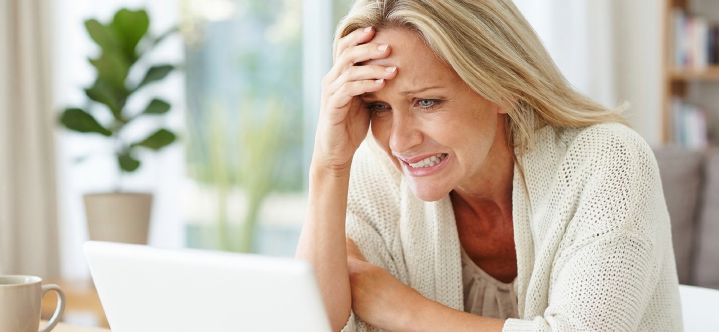 Young professional researching EB-1 extraordinary ability and U.S. immigration options on a laptop